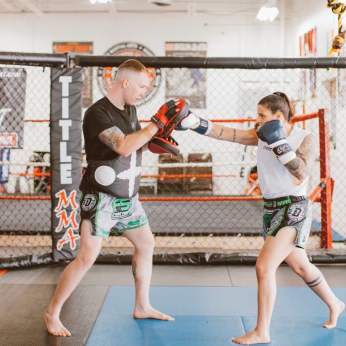 Dave holds pads for Fernanda