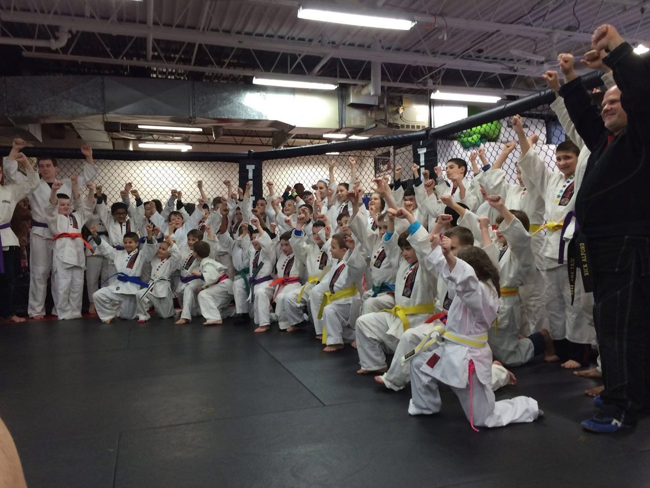 Youth students celebrating a belt promotion